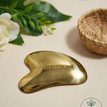 Kansa gua sha facial tool sculpting jawline and cheek contours