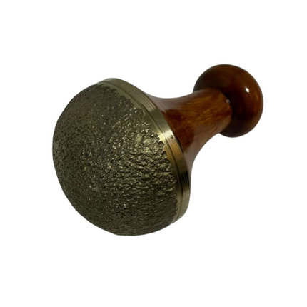 Using Kansa Vatki Scrub with Handle for body massage and exfoliation