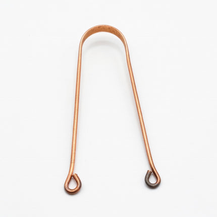 copper tongue cleaner in bathroom wellness routine natural oral care setup