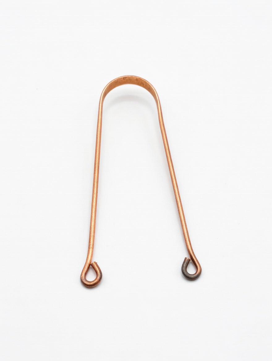 copper tongue cleaner in bathroom wellness routine natural oral care setup