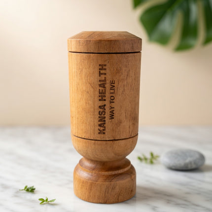 Person drinking water from Vijaysar wooden tumbler for Ayurvedic wellness