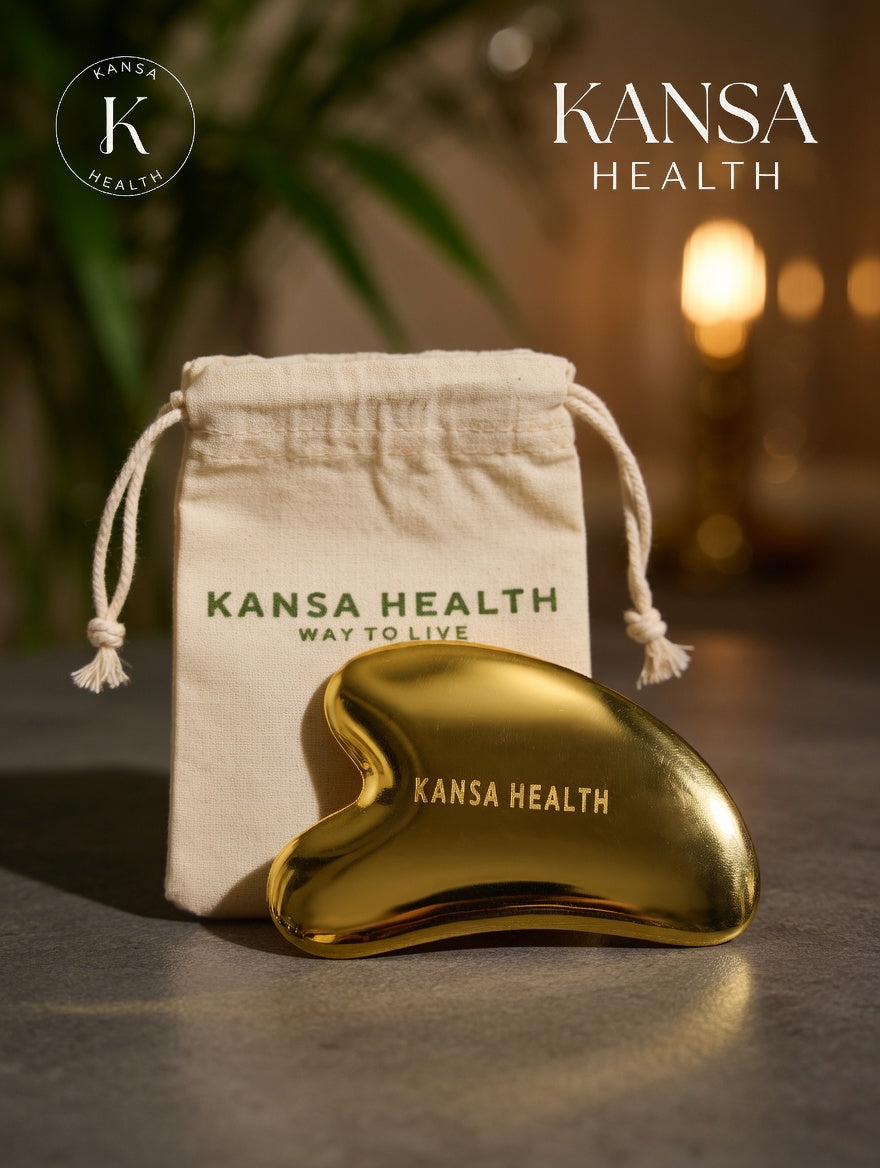 Woman using Kansa gua sha tool for facial massage and lymphatic drainage