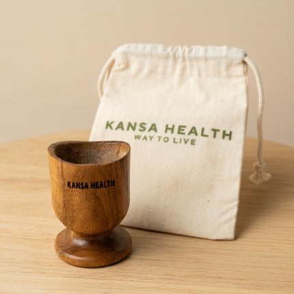 close‑up of natural neem wood eye wash cup texture and ergonomic design for eye rinsing