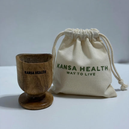 user holding neem eye wash cup demonstrating Ayurvedic eye hygiene and rinsing practice