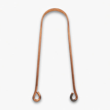close up of pure copper tongue cleaner mindi showing smooth curved design