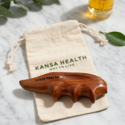 therapist using wooden thumb massage tool to relieve muscle tension and strain