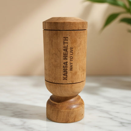 Person drinking water from Vijaysar wooden tumbler for Ayurvedic wellness