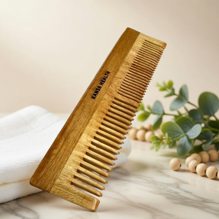 Woman combing hair with neem wooden comb for natural scalp care