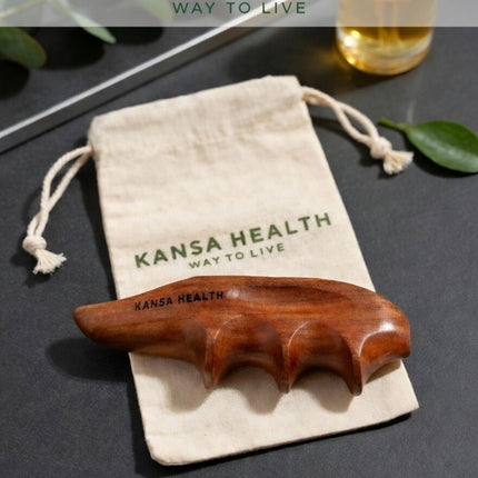 wooden thumb saver tool in hand applying pressure for deep tissue massage